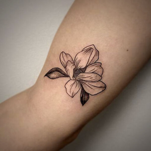 black and white tattoo of a flower