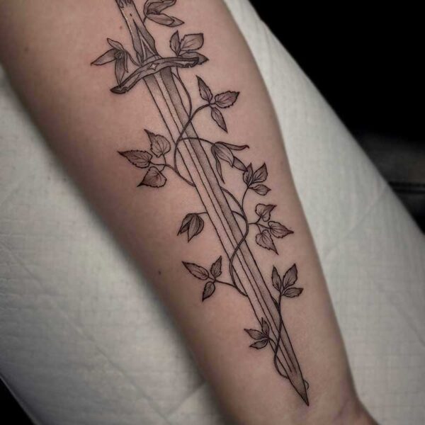 fine line tattoo of a sword and vine