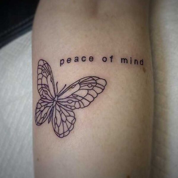 line tattoo of a butterfly and the words "peace of mind"