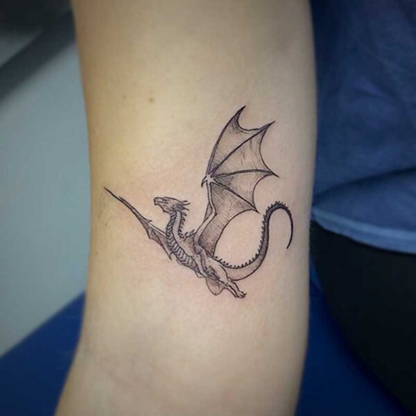 fine line tattoo of a dragon