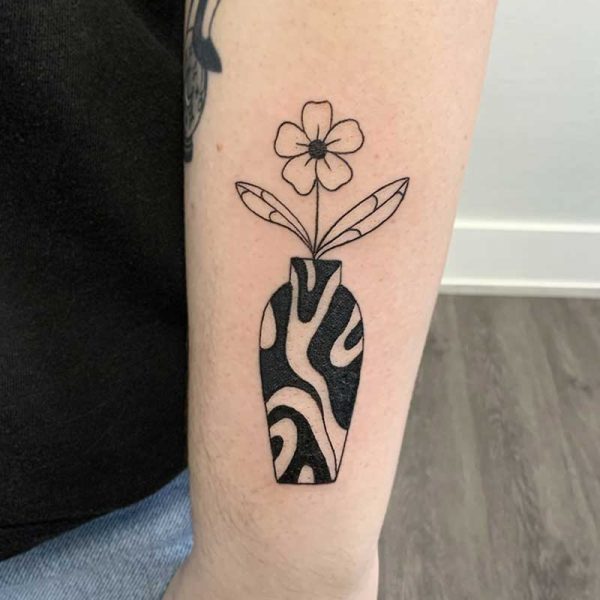 atticus tattoo, flower vase tattoo with black and white swirls
