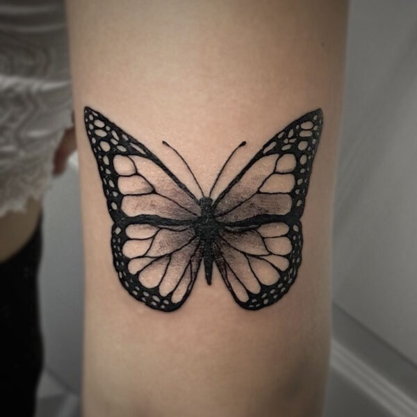 black and grey tattoo of a butterfly