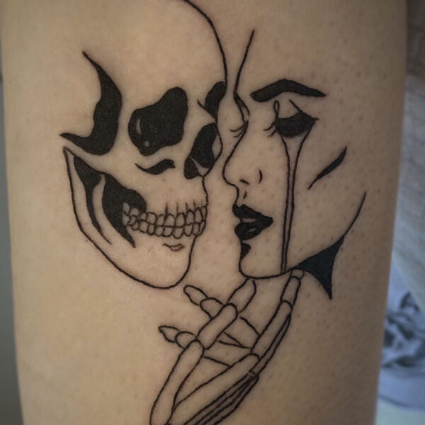 black line tattoo of a skeleton holding the chin of a woman that is crying