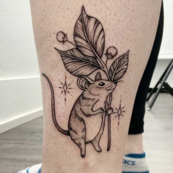 atticus tattoo, black and white tattoo of a mouse holding a stem of leaves