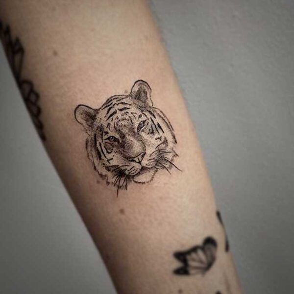 black and white tattoo of a tigers face