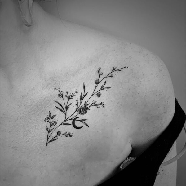 fine line tattoo of a stem of flowers