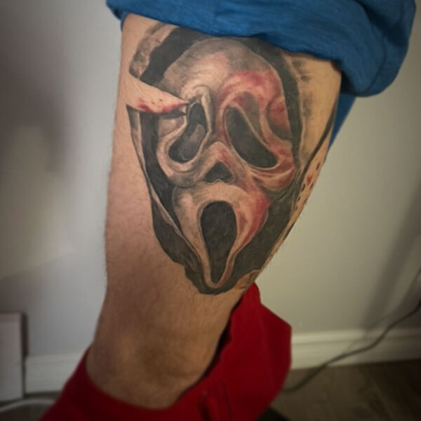 atticus tattoo, black and white tattoo of the scream mask with red blood