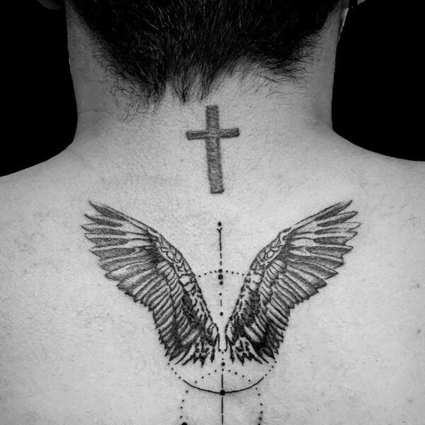 black and white tattoo of angles wings and circles