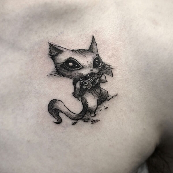 atticus tattoo, black and grey tattoo of a stylized cat eating a fish