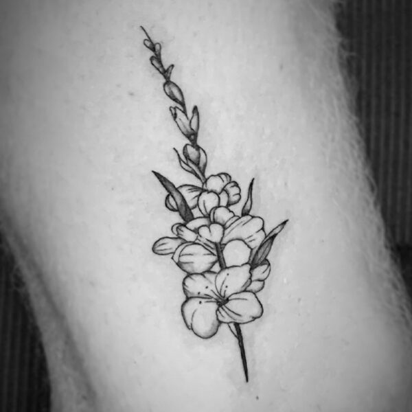 black and white tattoo of flowers