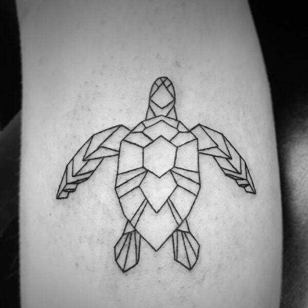 fine line tattoo of a geometric sea turtle