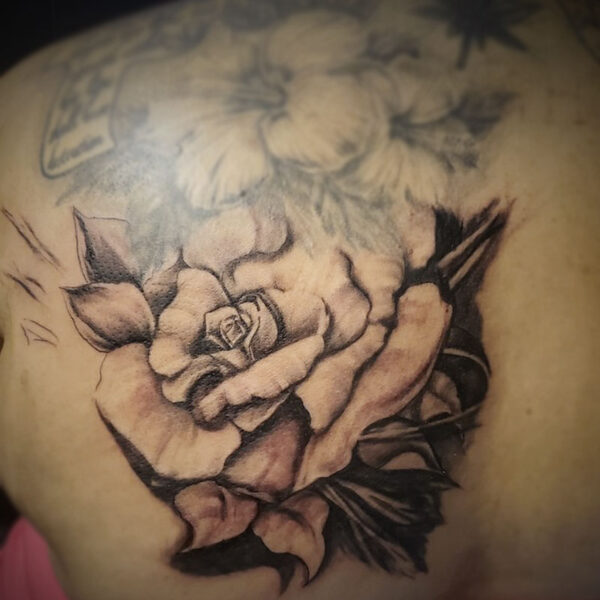atticus tattoo, black and white realism tattoo of a rose