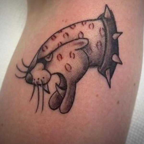 atticus tattoo, old school tattoo of a leopard with red spots