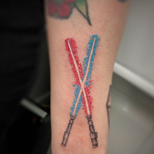 atticus tattoo, coloured tattoo of a red and blue light saber
