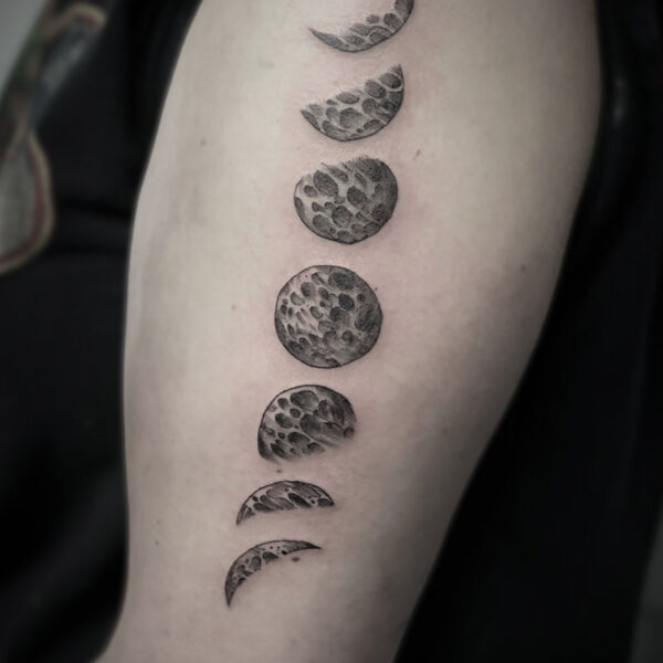 atticus tattoo, black and white tattoo of the phases of the moon