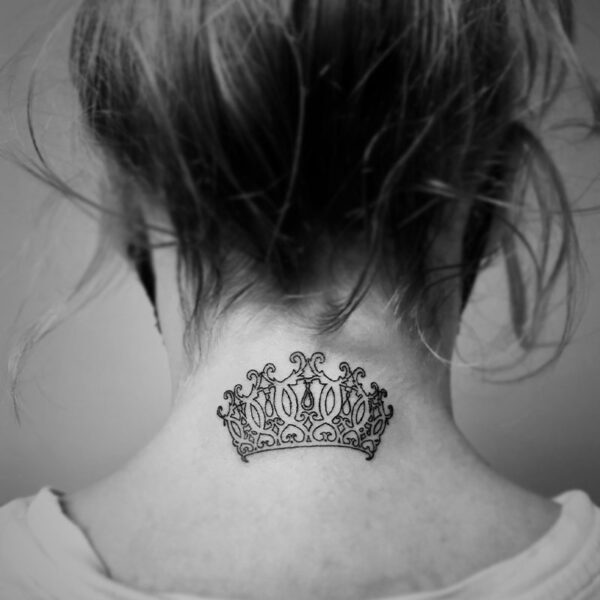 black and white tattoo of a detailed crown