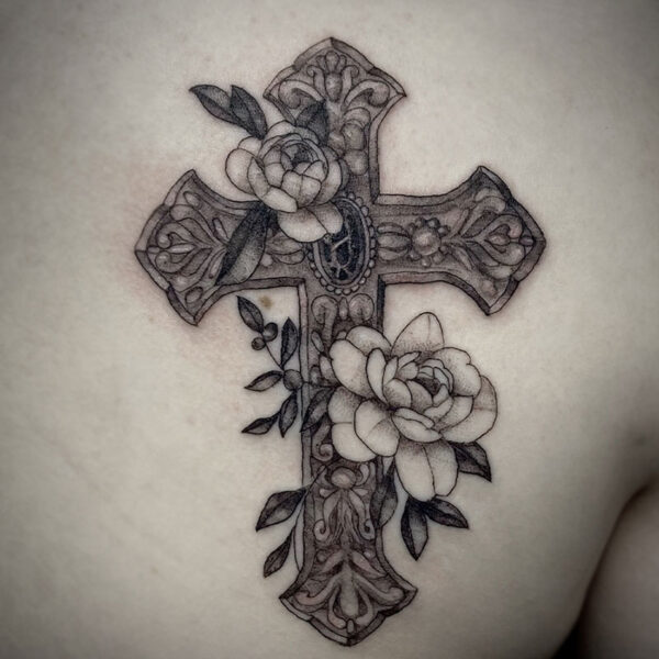 highly detailed tattoo of a cross and roses