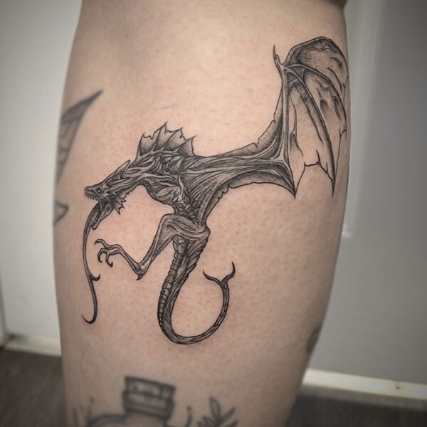 atticus tattoo, black and grey tattoo of a wyvern