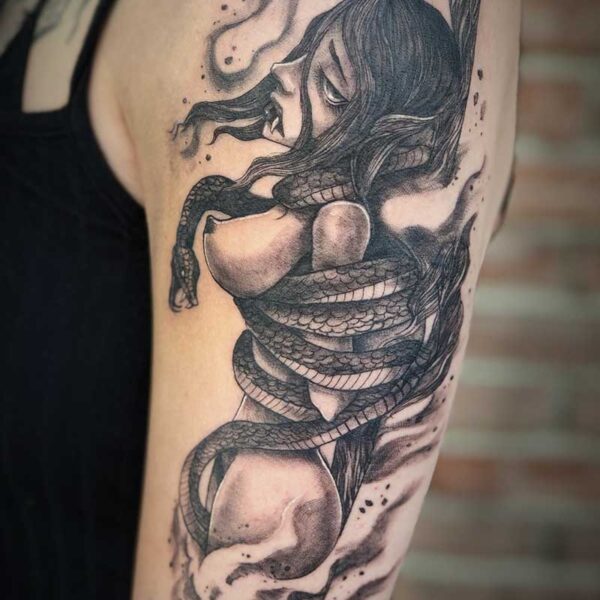 atticus tattoo, black and grey tattoo of anaked vampire lady burning at a stake