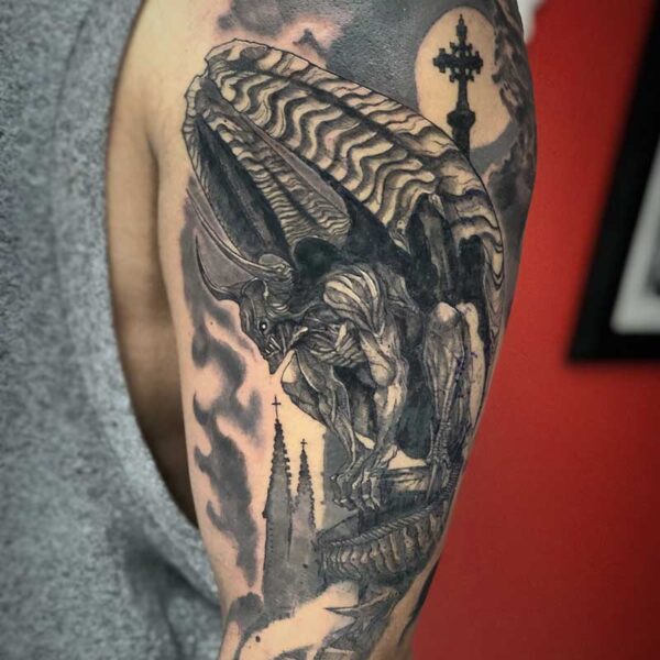 atticus tattoo, black and grey tattoo of a gargoyle with a castle, moon and clouds in the background