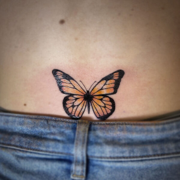 atticus tattoo, coloured tattoo of a monarch butterfly