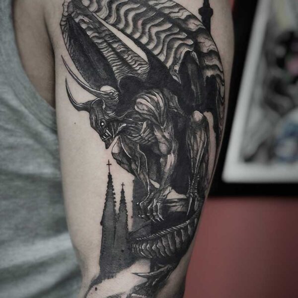 atticus tattoo, black and grey tattoo of a gargoyle with a castle in the background