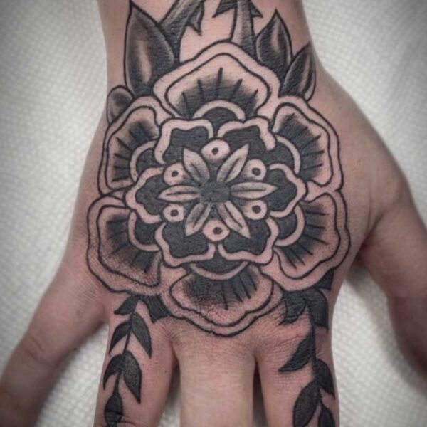 atticus tattoo, black and grey old school tattoo of a flower