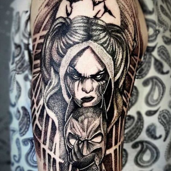 atticus tattoo, black and grey tattoo of Harley Quinn holding Batman's mask