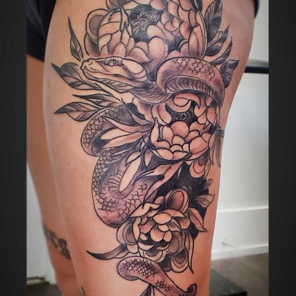 atticus tattoo, black and grey tattoo of a snake with peonies