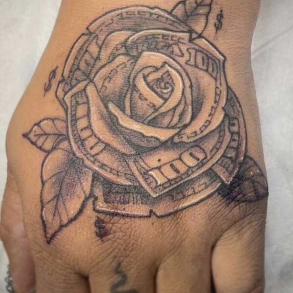atticus tattoo, black and white tattoo of a rose made out of 100 dollar bills