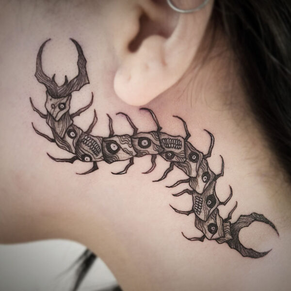 atticus tattoo, black and grey tattoo of a monster centipede
