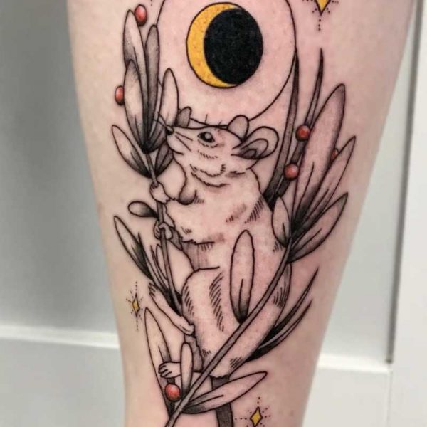 atticus tattoo, black and white tattoo of a mouse with stems of leaves, red berries and yellow moon and sparkles