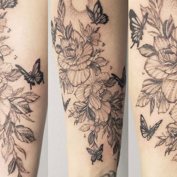 atticus tattoo, fine line tattoo of flowers and butterflies