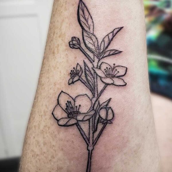 atticus tattoo, black line tattoo of flowers