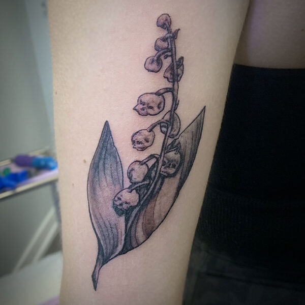 atticus tattoo, black and grey tattoo of snapdragons
