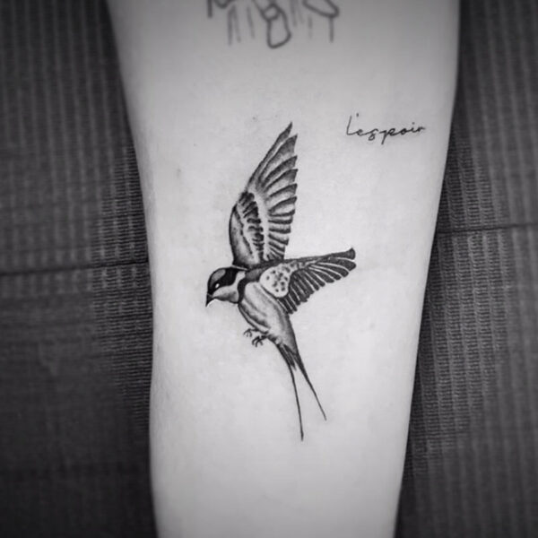 black and white tattoo of a sparrow