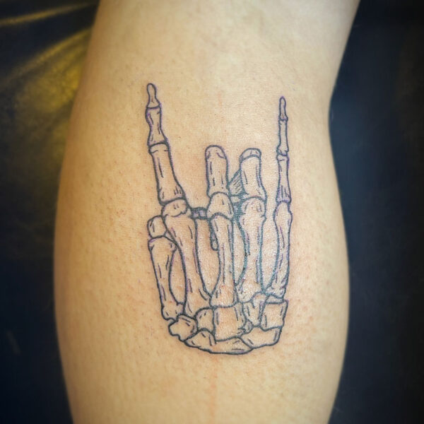 black line tattoo of a skeleton hand