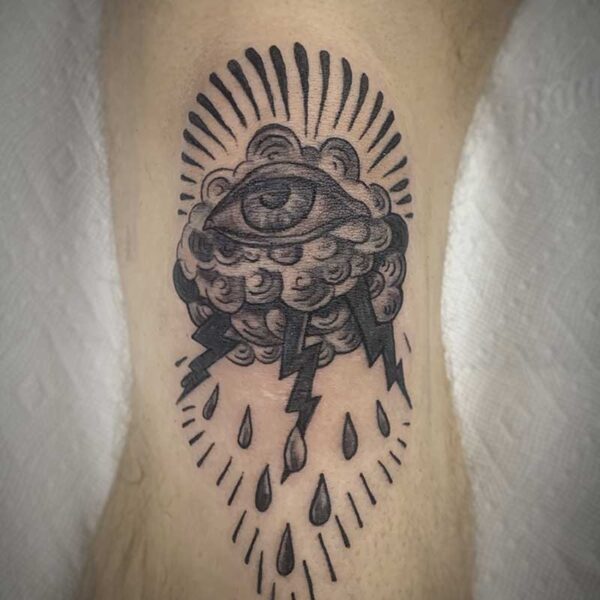 atticus tattoo, black and grey tattoo of an eyeball sitting on a cloud with lightning and rain