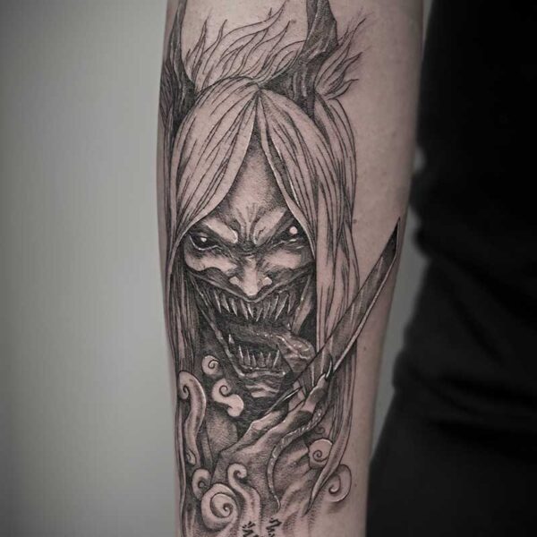 atticus tattoo, black and white tattoo of a demon licking a knife