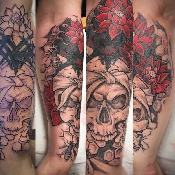 atticus tattoo, tattoo of a human skull with red roses and bees