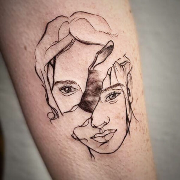 atticus tattoo, black and grey tattoo of a woman's face split in half and a moon peaking through the gap