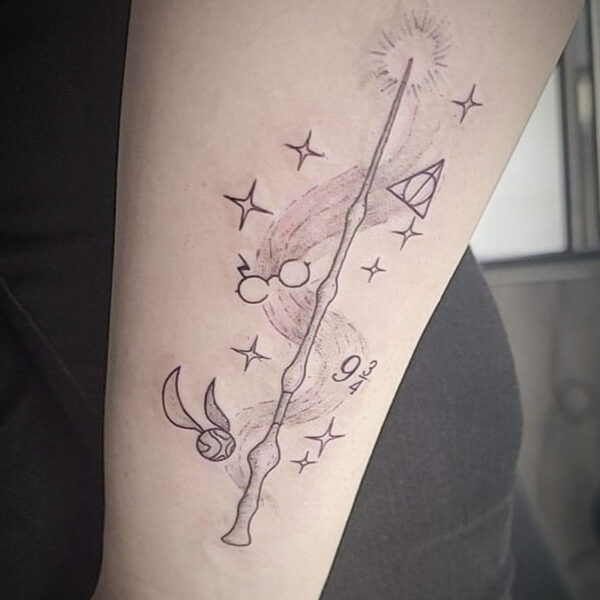 atticus tattoo, harry potter themed tattoo of the elder wand and other harry potter elements