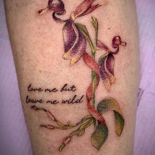 atticus tattoo, coloured tattoo of duck orchids and a quote