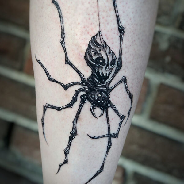 atticus tattoo, black and grey tattoo of a spider with a skull for it's body