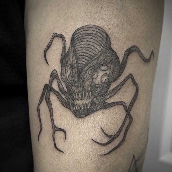 atticus tattoo, black and grey tattoo of a monster with several arms and eyes