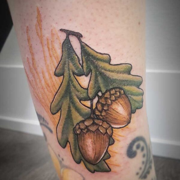 atticus tattoo, coloured tattoo of acorns and leaves
