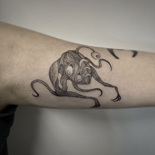atticus tattoo, black and grey tattoo of a monster with several arms and eyes