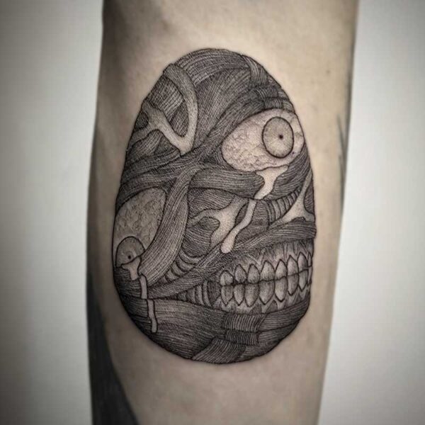 atticus tattoo, black and grey tattoo of an egg shaped monster with exposed muscle, an eye and teeth