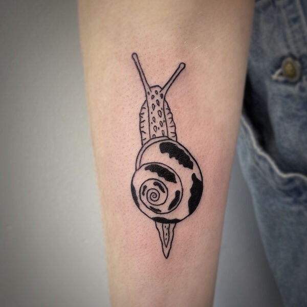 atticus tattoo, black line tattoo of a snail