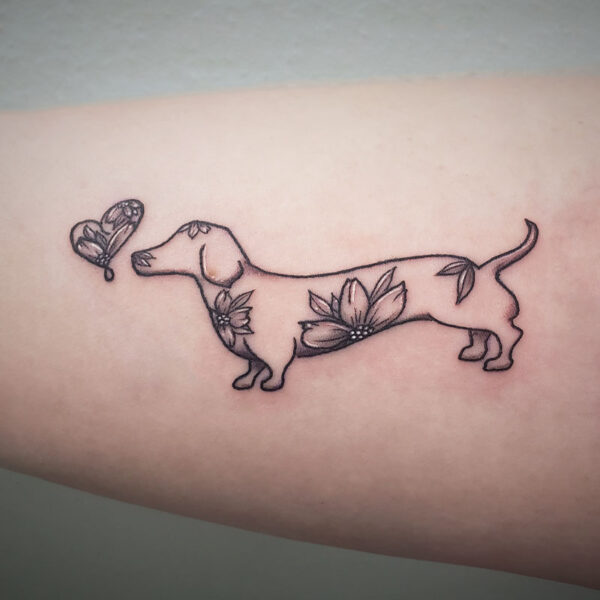 atticus tattoo, black and white tattoo of a dog with flowers and a butterfly